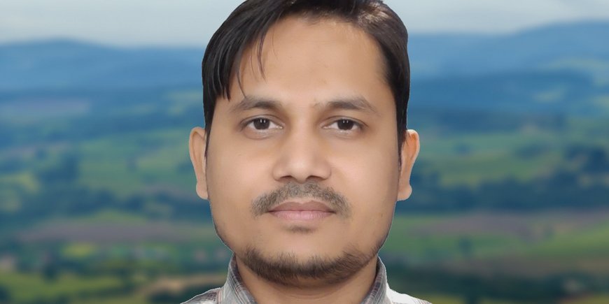 Profile photo of Sarwar Nizam in front of a blurred landscape.
